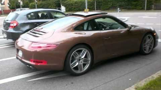 Barely disguised 2012 Porsche 911 caught on video at German gas station